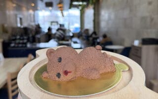 The Mocha House’s “Sleeping Bear” Dessert in Rochester. A chocolate mouse bear laying on a plate.